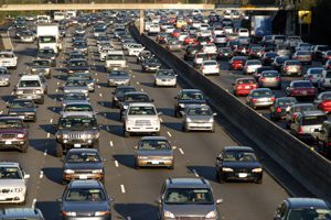 a large city highway with a large amount of motor vehicle traffic.