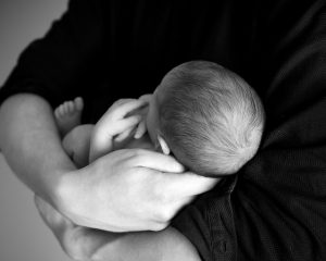 Parent Holding a baby - Riddle & Brantley