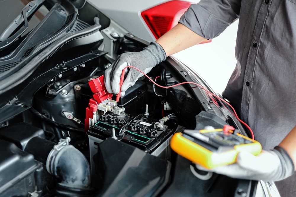 A Machinic Inspecting the Vehicle