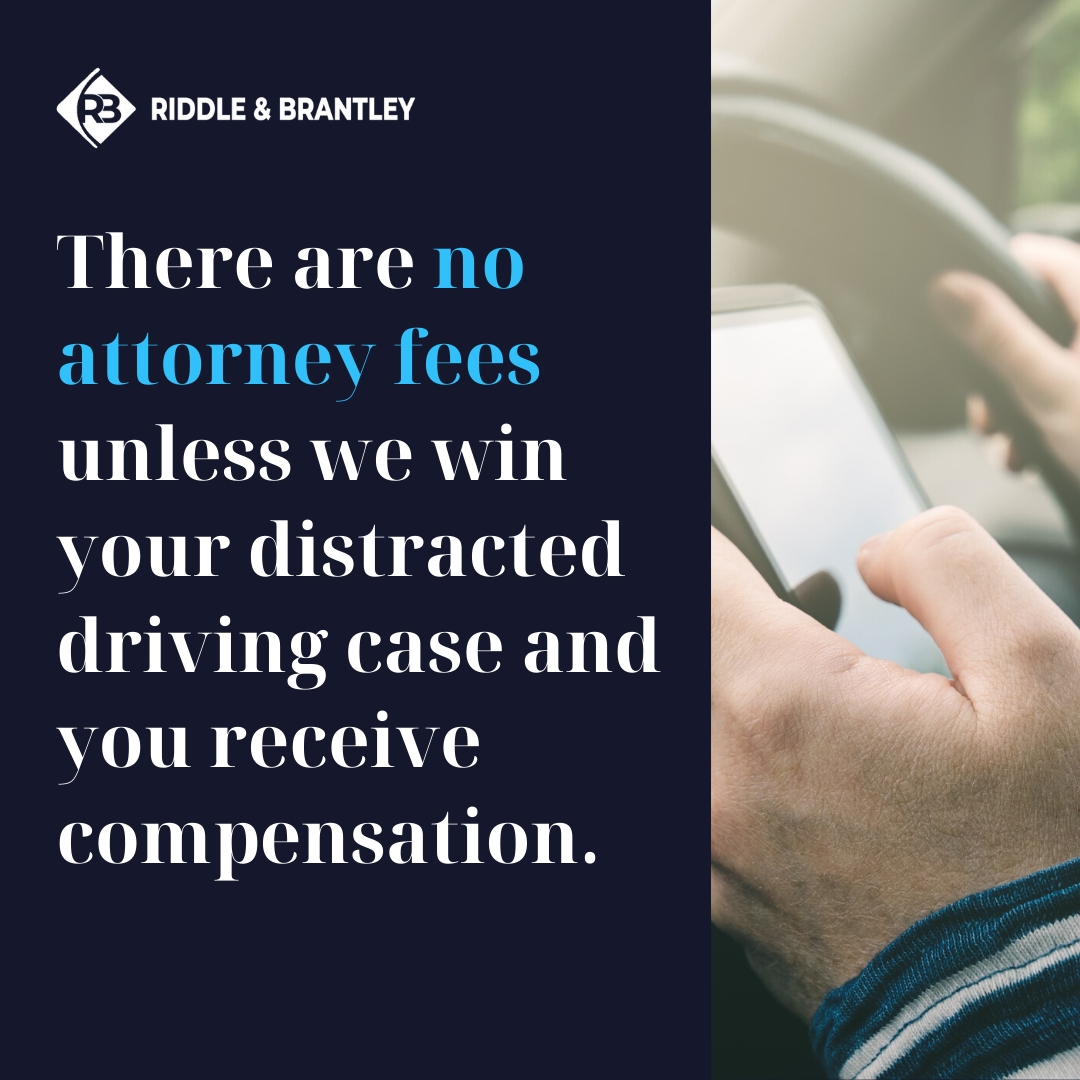 There are no attorney fees unless we win your distracted driving case and you receive compensation. Image of a person looking at a phone in their vehicle. 