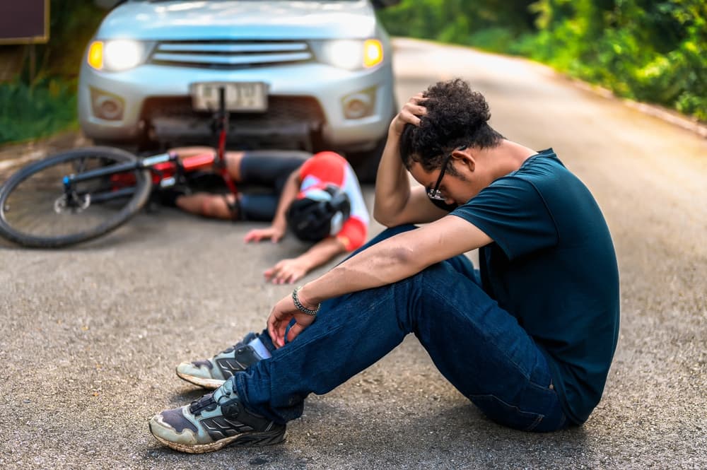 Car accident involving a cyclist, illustrating a potential personal injury case due to vehicle negligence.