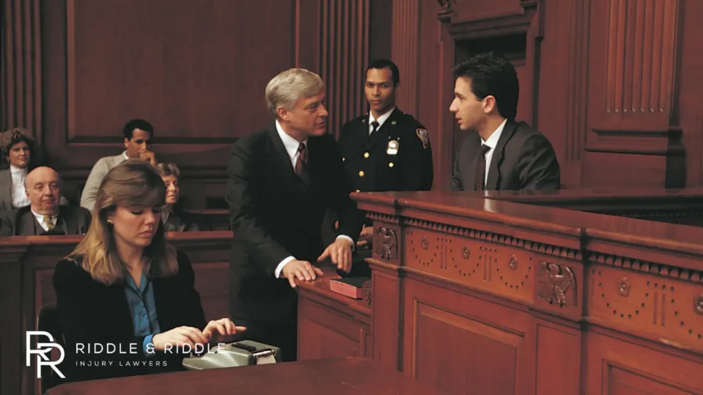 This image shows a courtroom scene with individuals present