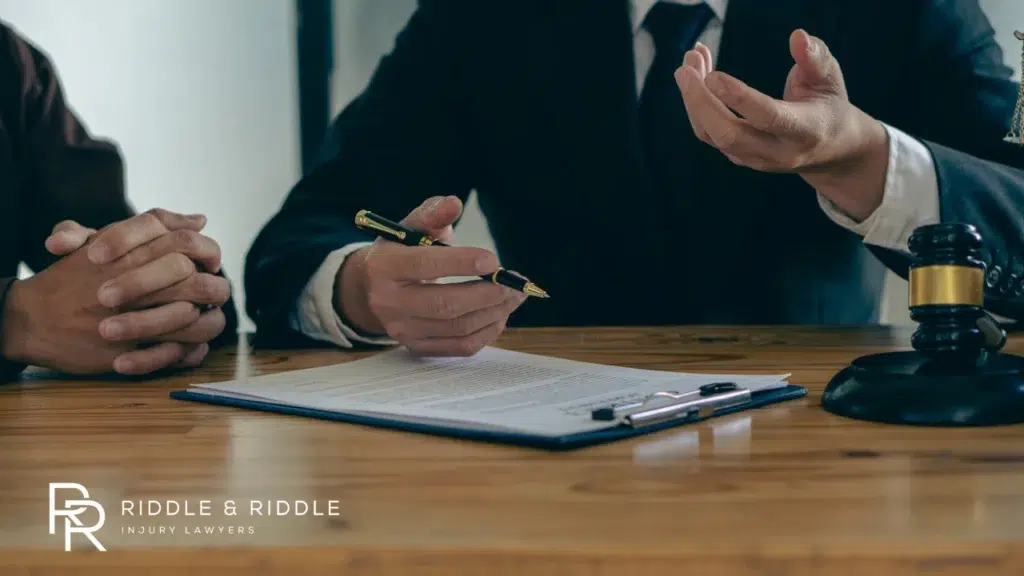 A lawyer explaining paperwork to a client