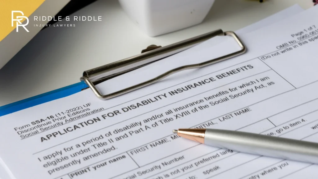 Close-up of an Application for Disability Insurance Benefits form with a pen