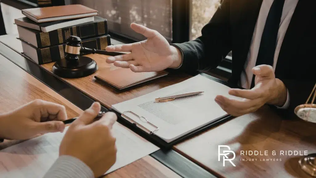 Lawyer raising his hands and discussing with a client