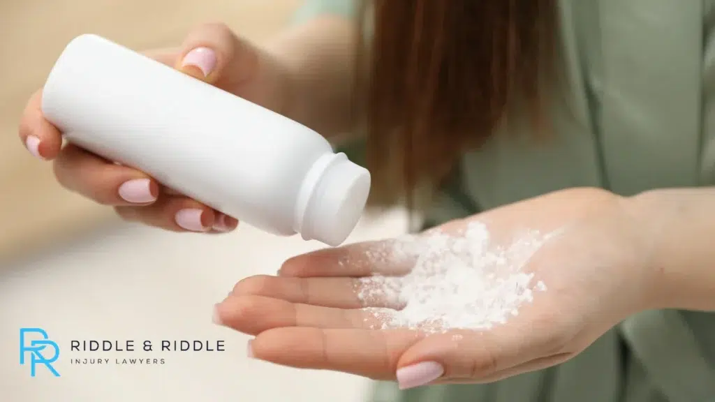 Woman holding talcum powder in her hand