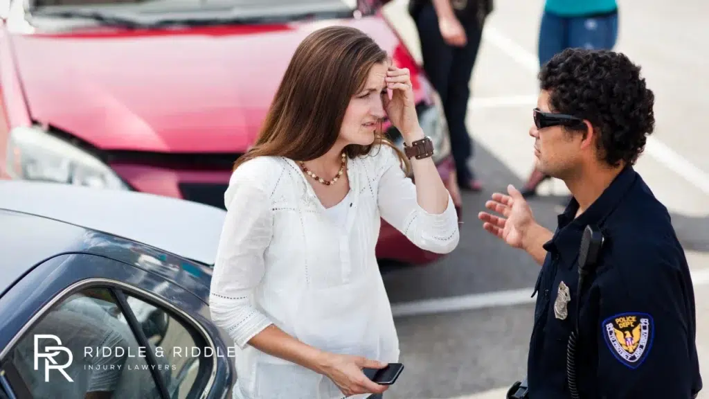 A woman reporting an accident to a Police officer
