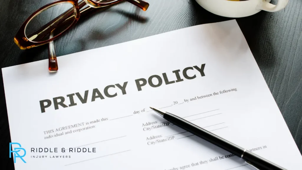An image of a privacy policy form with a pen on the table