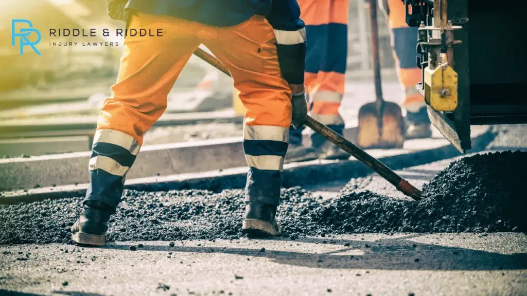 A man working on a road construction project