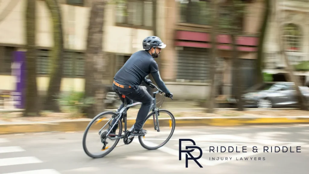 Man riding on his bike on a city street